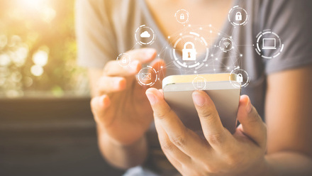 Using smartphone with icon graphic cyber security network of connected devices and personal data iStock-1090870004.jpg 2